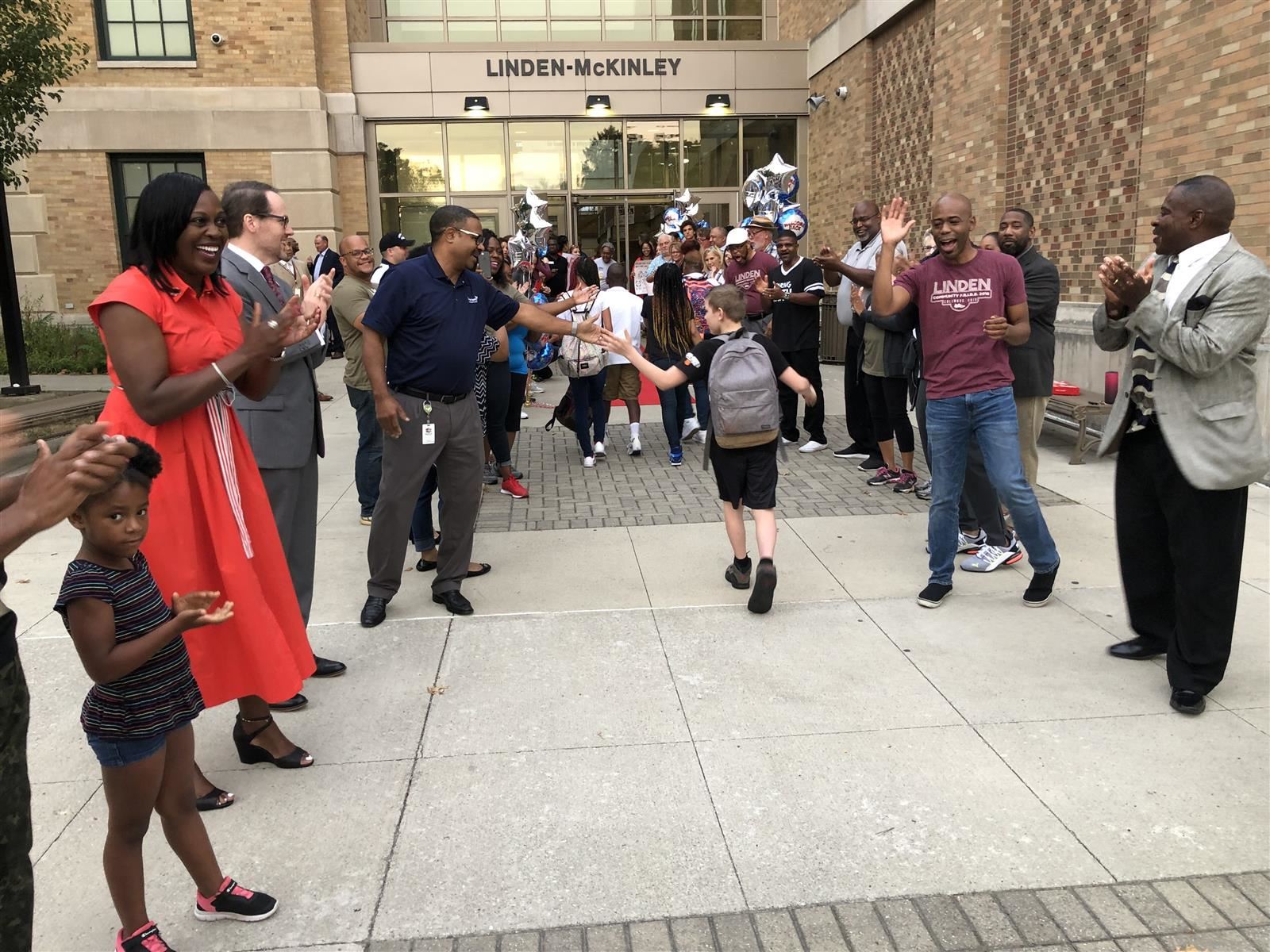 Columbus Schools Superintendent Talisa Dixon, second from left, welcomes students back to school 